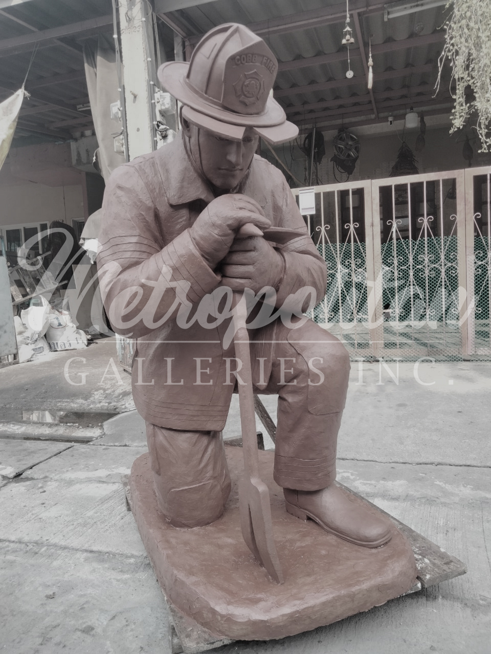 Kneeling Firefighter Sculpture in Clay Wax prior to mould creation by Metropolitan Galleries