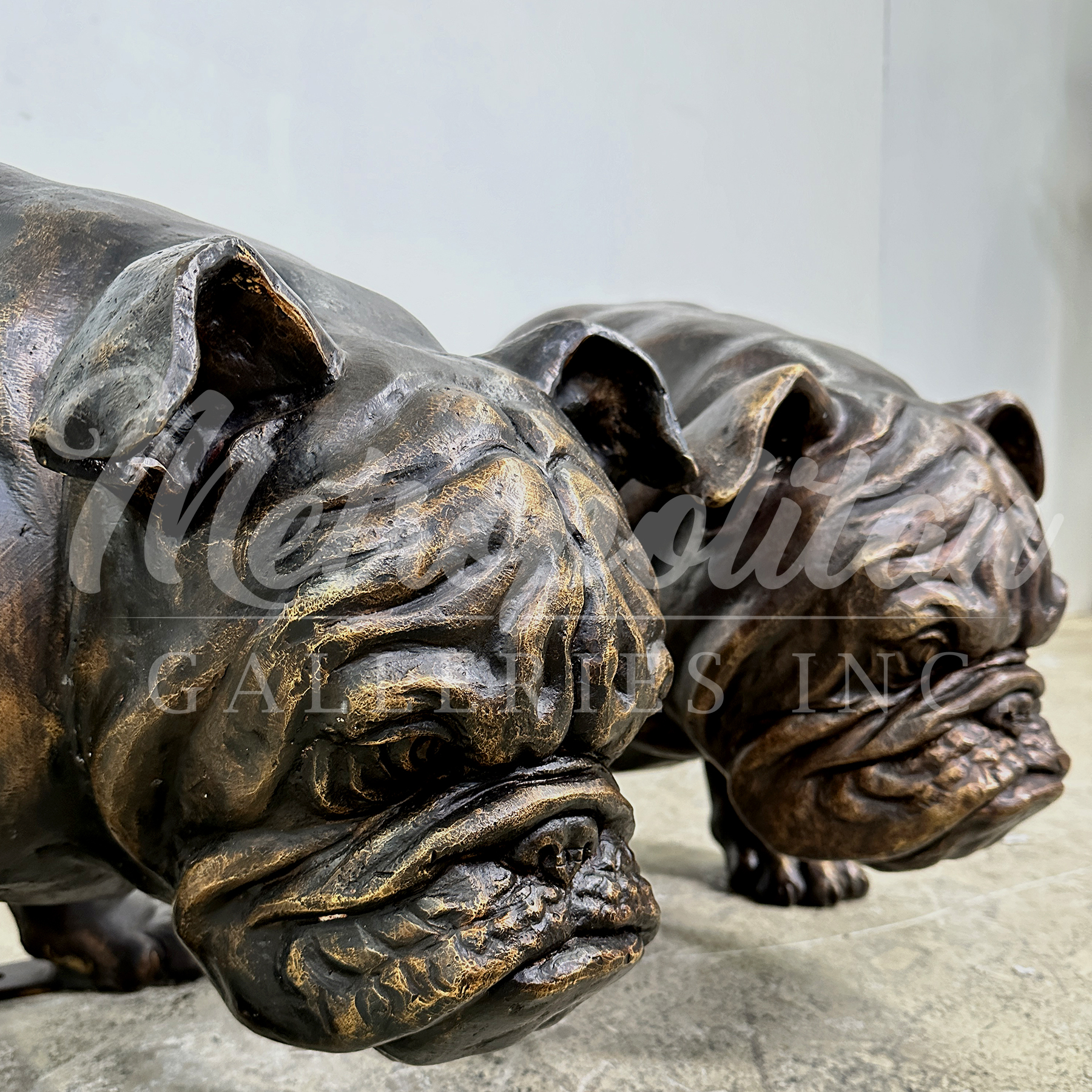 SRB10136 Bronze Left & Right Bulldog Looking Down Sculpture Set exclusively designed and produced by Metropolitan Galleries Inc.